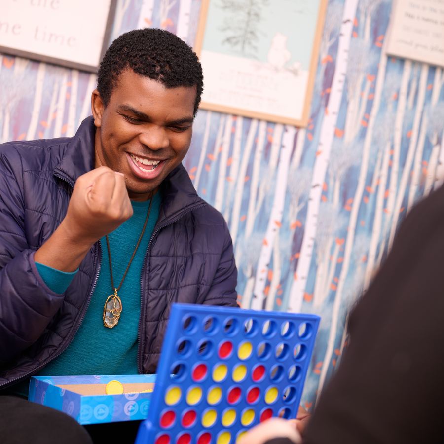 A client celebrating progress during a counseling session