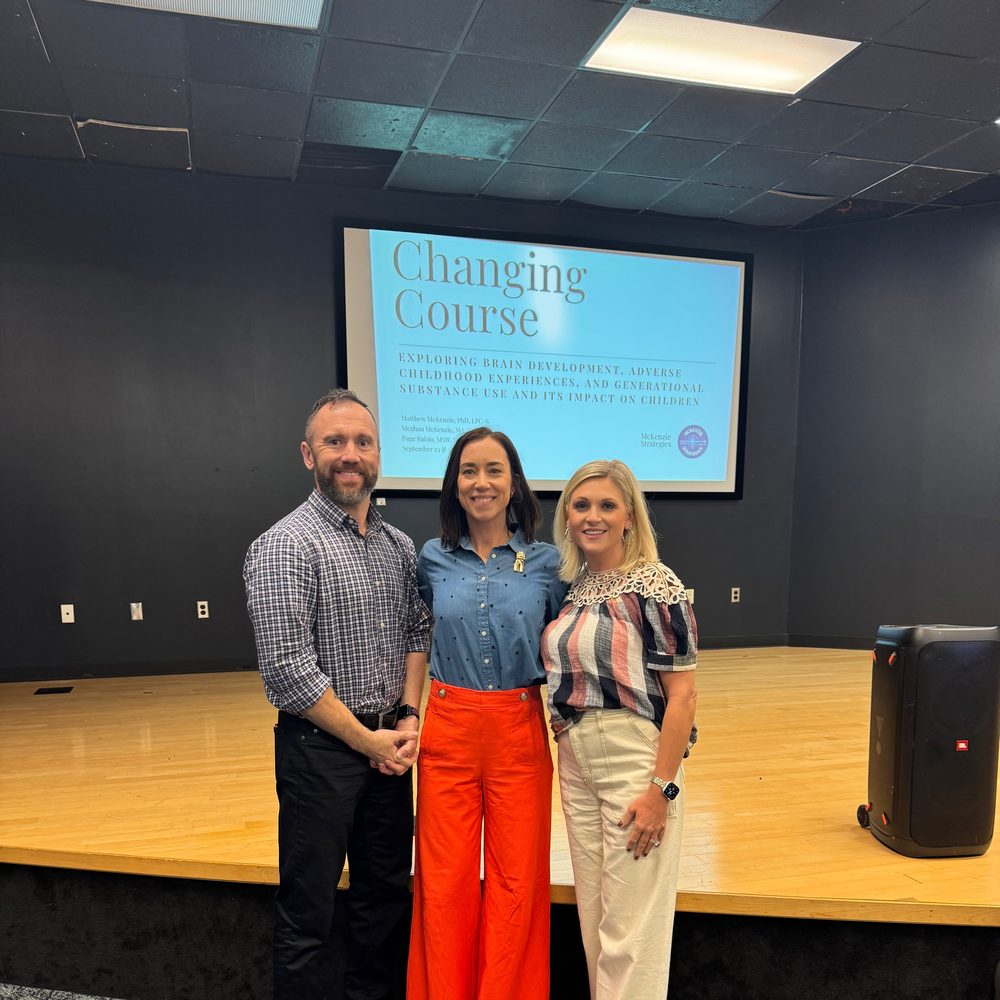 Matt McKenzie, Meghan McKenzie, and Page Rubin presenting a "Changing Course" training